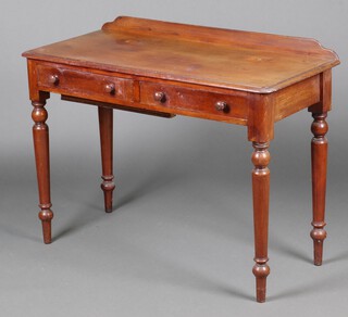 A Victorian bleached mahogany dressing table with raised back, fitted 2 drawers and a crude secret drawer to the underside, raised on turned supports 78cm h x 104cm w x 46cm d 