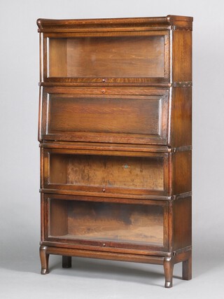 An oak 4 section Globe Wernicke bureau bookcase, the 2nd section fitted a fall front with well fitted interior 151cm h x 86cm w x 30cm d 