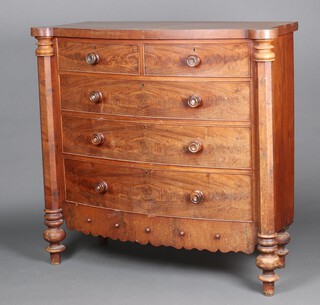 A Victorian bleached mahogany bow front chest of 2 short and 3 long drawers with turned handles and columns to the sides 127cm h x 132cm w x 52cm d 