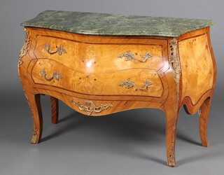 A 20th Century inlaid figured walnut commode of serpentine and bombe form and green veined marble top, fitted 2 long drawers, with gilt metal mounts,  raised on cabriole supports 83cm h x 123cm w x 55cm d 