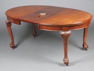 An Edwardian Chippendale style mahogany oval extending dining table with 2 extra leaves, raised on cabriole ball and claw supports 76cm h x 133cm w x 224cm l when fully extended, complete with winder  