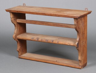 A Continental carved oak 2 tier hanging shelf with moulded cornice 55cm h x 84cm w x 27cm d 