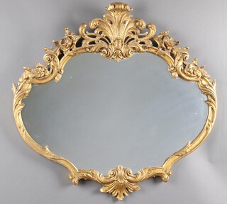 A 1920's shaped plate wall mirror contained in a gilt plaster frame 79cm h x 83cm w