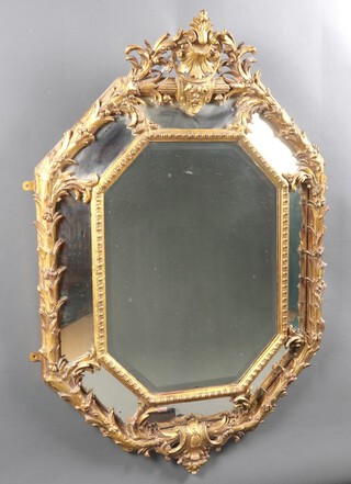 A Regency style octagonal plate mirror contained in a gilt plaster frame with swag decoration 134cm h x 89cm w 