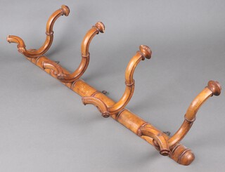 A bamboo 3 hook coat rack 24cm h x 80cm w 