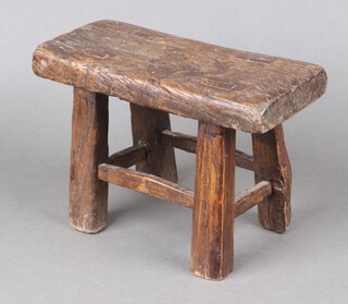 A 19th Century rectangular elm stool raised on square supports with box framed stretcher 18cm h x 28cm w x 12cm d  