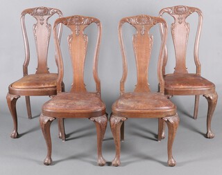 A set of 4 19th Century Continental carved oak slat back dining chairs with upholstered seats, raised on cabriole supports 110cm h x 50cm w x 46cm d 