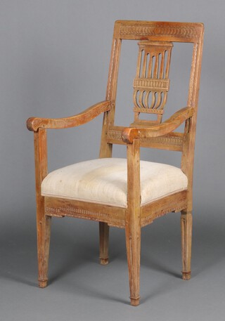 A 19th Century Continental carved beech open arm chair with vase shaped slat back, over stuffed seat, raised on square tapered supports with spade feet 108cm h x 51cm w x 54cm d 