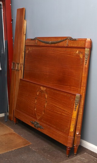 An early 20th Century French inlaid mahogany double panel end bedstead with gilt metal swags 151cm h x 157cm w x 213cm d, complete with side bars 