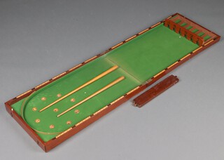 An Edwardian table top billiard table 150cm x 41cm, complete with 2 cues and contained in a mahogany case