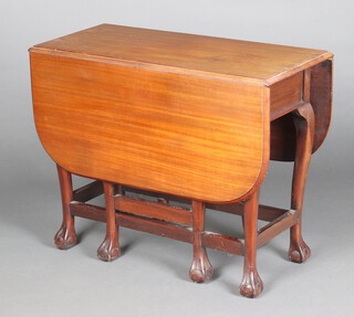 A mahogany drop flap dining table