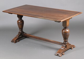 An oak refectory style dining table, raised on bulbous turned supports with H framed stretcher 74cm h x 152cm l x 75cm w 