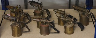 Nine various brass blow lamp torches 