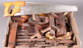 A collection of  moulding planes and other tools