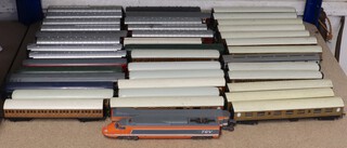A collection of 40 Hornby and other model railway carriages
