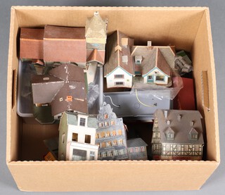 A collection of wooden and plastic model railway buildings 
