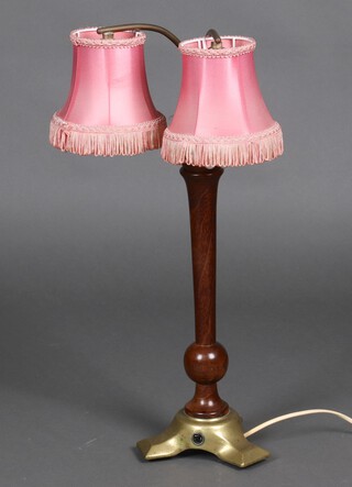 A 1930's turned wooden and brass twin light table lamp 55cm