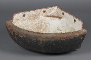 A cast iron wall mounted animal feeder 29cm h x 70cm w x 51cm d 