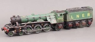 A pressed metal model of The Flying Scotsman locomotive and tender 11cm h x 61cm l x 11cm w 
