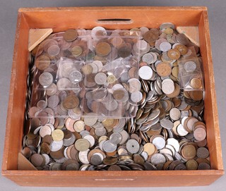 A large quantity of various world coinage, contained in a rectangular mahogany tray 