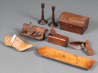 A Victorian dome shaped rosewood tea caddy (water damaged), a pair of turned wooden candlesticks and other items of treen 