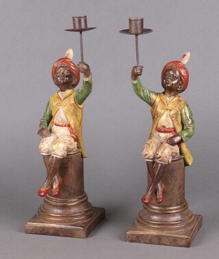 A pair of 18th Century style candlesticks in the form of seated liveried servants 37cm 