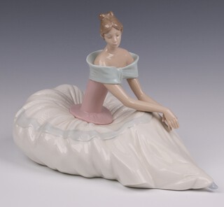A Nao figure of a seated lady in a ball gown, the base impressed 1266 20cm 