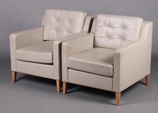 Boss, a pair of armchairs upholstered in grey leather material, raised on square supports 75cm h x 72cm w x 82cm (some wear to the arms) 
