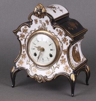 A striking mantel clock with 10cm dial contained in a shaped blue and gilt pottery case 25cm (no key) 