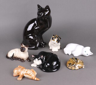 A Royal Doulton figure of a Siamese cat 13cm and 6 other pottery figures of cats