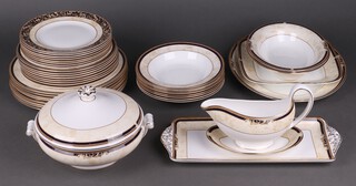 A 39 piece Wedgwood Cornucopia pattern dinner service comprising tureen and cover, 8 dinner plates, 8 side plates, 8 tea plates, 8 pudding bowls, oval meat plate, 2 oval bowls, bread plate, rectangular plate, sauce boat and stand 