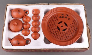 A Chinese 12 piece tan ware tea set, boxed