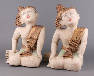 A pair of 20th Century Burmese carved and painted figures of kneeling temple attendants with mirrored decoration 38cm h x 30cm w
