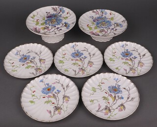 A German 7 piece dessert service with 2 comports and 5 plates with floral decoration  (2 cracked, some chips to edges) 