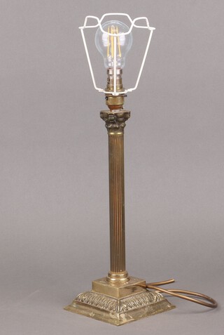 A brass table lamp with Corinthian column capital 32cm 