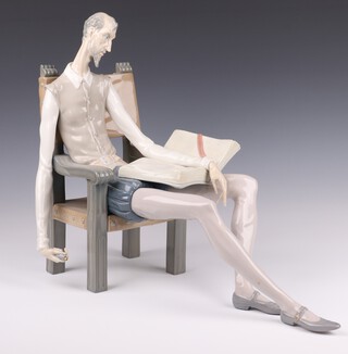 A Lladro figure of a seated Don Quixote 39cm (missing sword) 