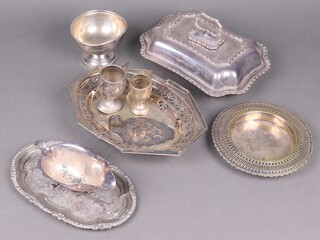 A silver plated entree dish and cover, an oval pierced cake basket with swing handle and a collection of plated items 