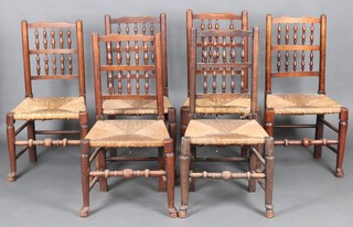A harlequin set of 6 18th Century elm spindle back dining chairs with woven rush seats (frames loose)