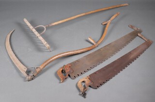 A wooden rake, a scythe and 2 drag saws