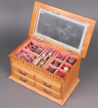 A small quantity of costume jewellery contained in a wooden jewellery case with hinged lid, the base fitted 2 drawers 
