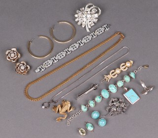 A collection of costume jewellery including brooches, earrings and pendant 