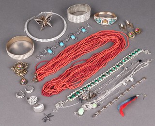 A string of coral coloured beads and a small collection of costume jewellery 