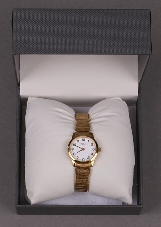 A lady's Rotary wristwatch contained in a gold plated case on a gold plated expanding bracelet 