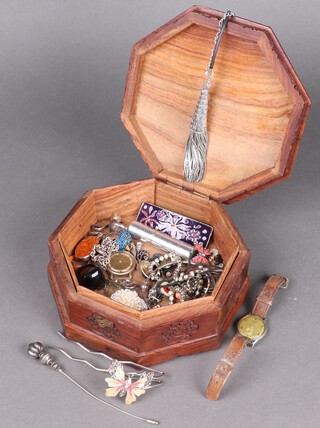 A silver curb link bracelet with padlock clasp and a  collection of costume jewellery contained in an octagonal Eastern carved hardwood box  