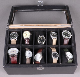 Ten fashion/replica military watches in a presentation case 
