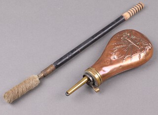 A reproduction embossed copper powder flask 17cm, together with a gun cleaning rod 34cm 