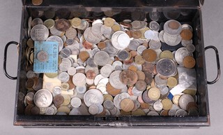 A collection of mixed coinage contained in a metal deed box