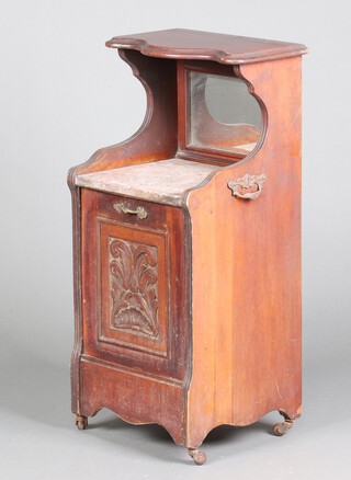An Edwardian carved walnut coal purdonium, the raised back fitted a mirror 87cm h x 41cm w x 36cm d 