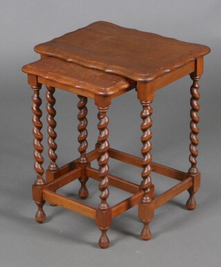 A nest of 2 1930's oak coffee tables with pie crust edge, on spiral turned supports 52cm h x 45cm w x 33cm d (ring mark to top) 