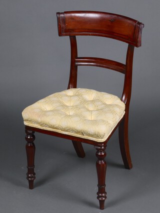 A 19th Century mahogany bar back chair with over stuffed buttoned seat, raised on turned supports 